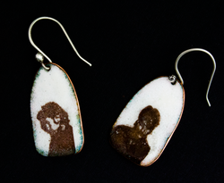 Earrings with face images from photo booth pictures enameled on to them
